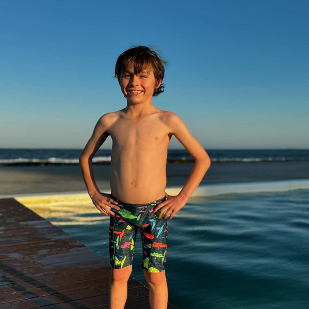 Boy wearing chlorine proof jammers his boy designed the girls one piece swimsuit